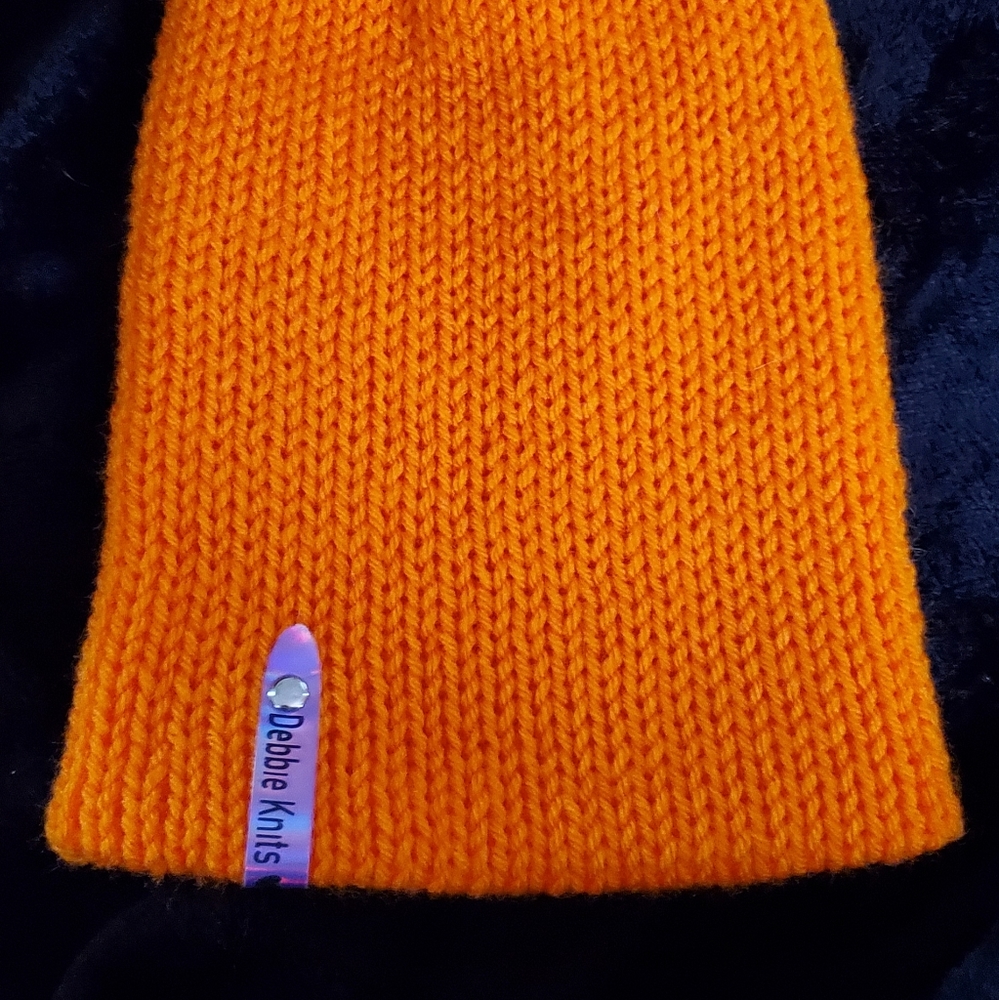 Orange knit beanie hat